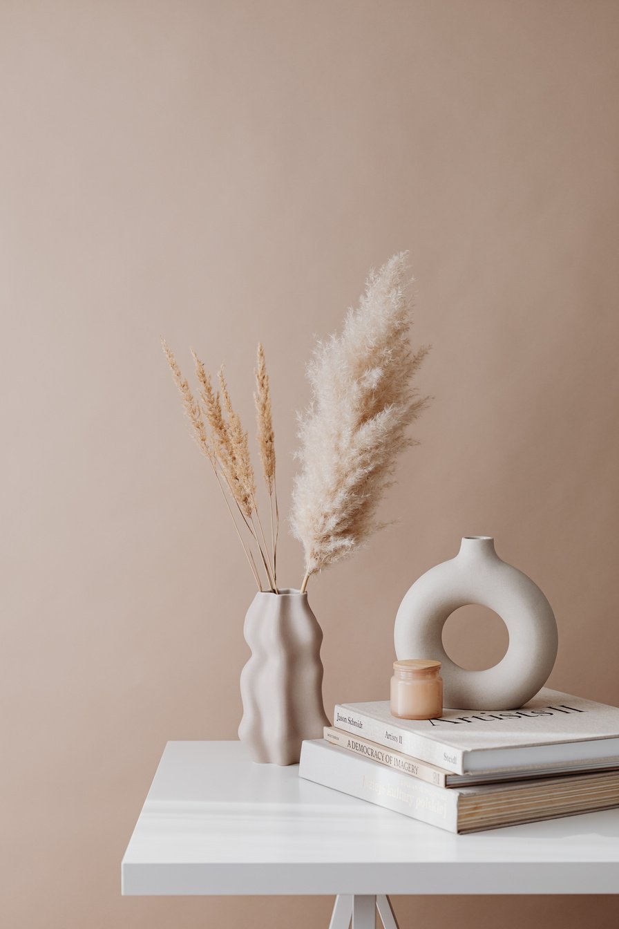 White Ceramic Vase on White Book