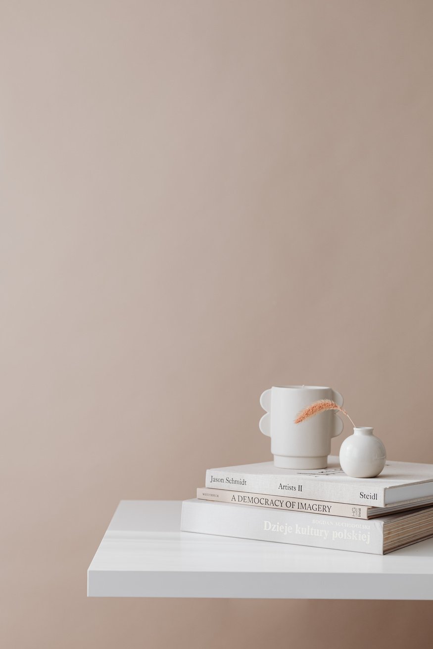 White Ceramic Teacup on White Book